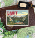 Load image into Gallery viewer, postcard save the date showing banff springs hotel and mountains
