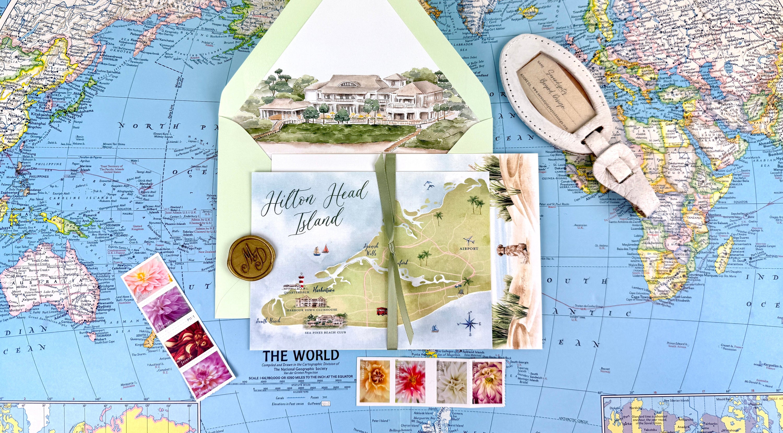 Map illustrations for travel-themed wedding items including an envelope, wax seal, and stamps.